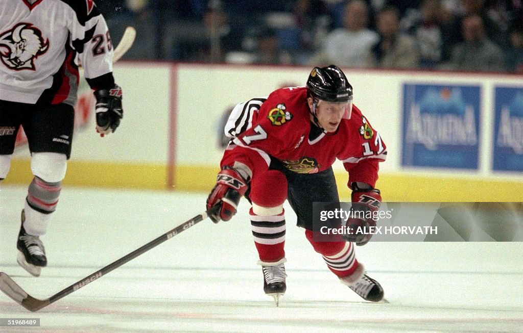 Chicago Blackhawks Reto Von Arx looks to steal a p