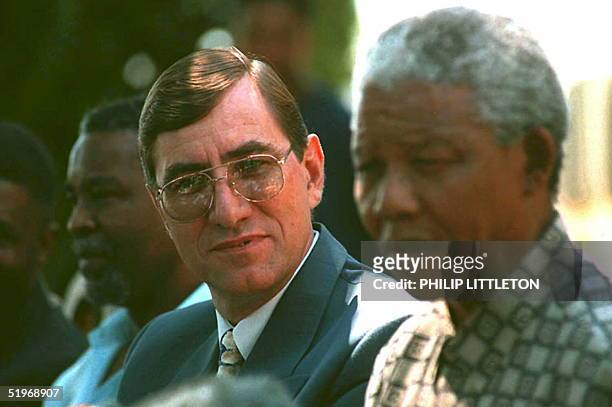 The new National Commissioner of the South African Police Services, George Fivaz , listens as President Nelson Mandela announces his appointment at...