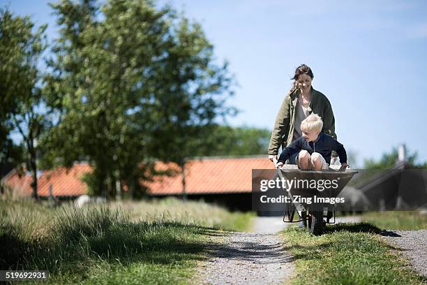mother and son - springtime home stock pictures, royalty-free photos & images