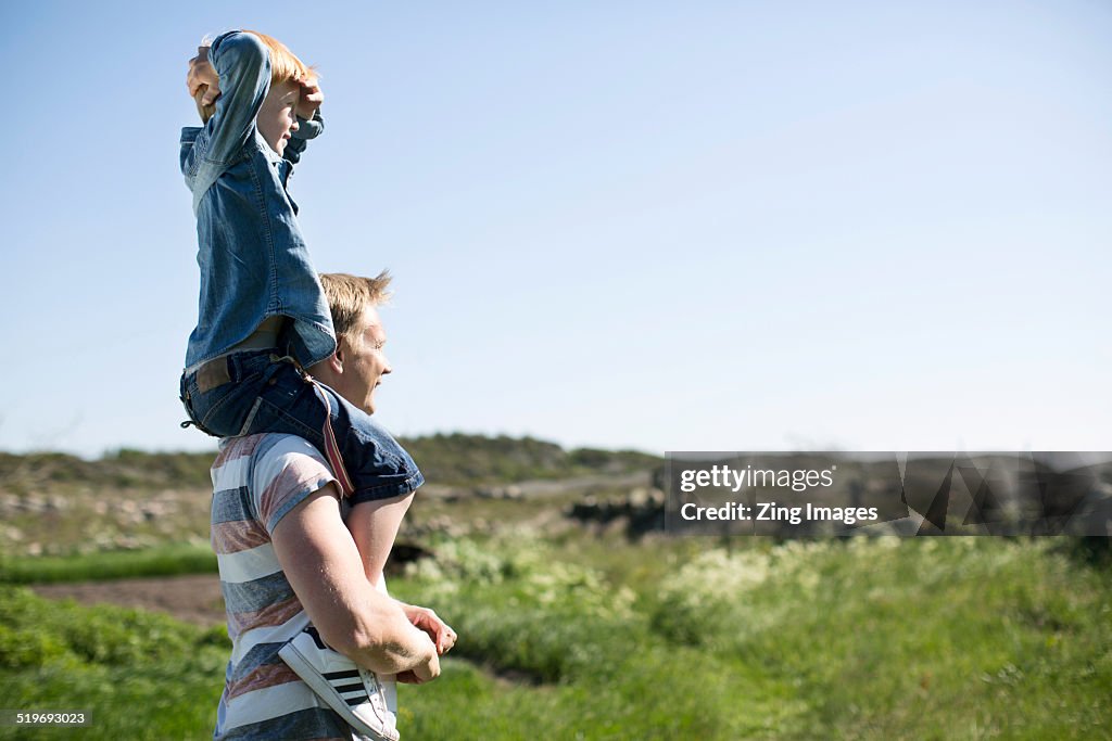 Boy on father's shoulders