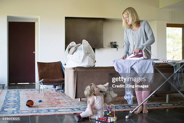 mother and toddler - ironing board imagens e fotografias de stock