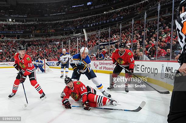 Jay Bouwmeester of the St. Louis Blues chases after the puck against Jonathan Toews, Richard Panik and Andrew Ladd of the Chicago Blackhawks in the...