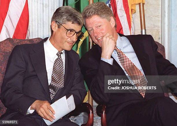President Bill Clinton speaks to Treasury Secretary Robert Rubin before giving remarks on the Mexican financial situation 18 January at the US...