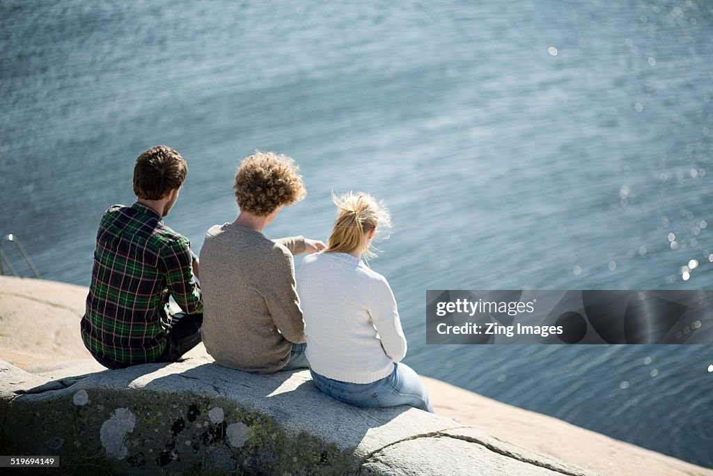 Teenagers looking at sea