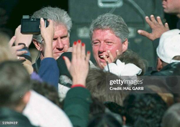 President Bill Clinton goes into the crowd at Cal State, Northridge, 17 January, following a speech to commemorate the Northridge quake a year ago...