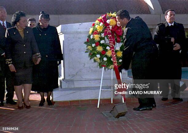 Dexter King, son of the slain civil rights leader Dr. Martin Luther King, places a wreath in front of his father's tomb as King's widow, Coretta...