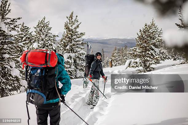 girls with big backpacks hiking in the mountain. - vail colorado stock-fotos und bilder