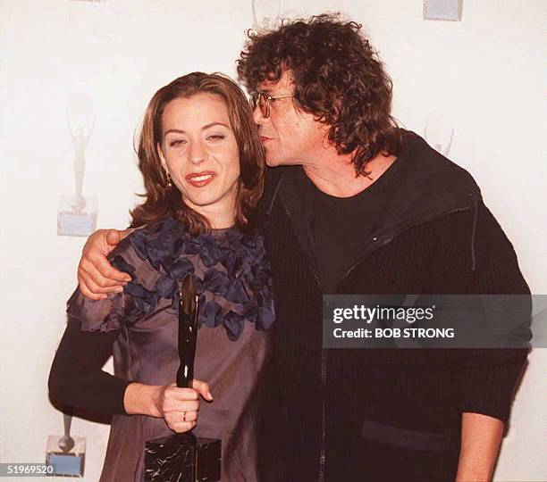 Lou Reed and Moon Unit Zappa pose for photographs after Reed inducted Moon Unit's father the late Frank Zappa into the Rock and Roll Hall of Fame 12...