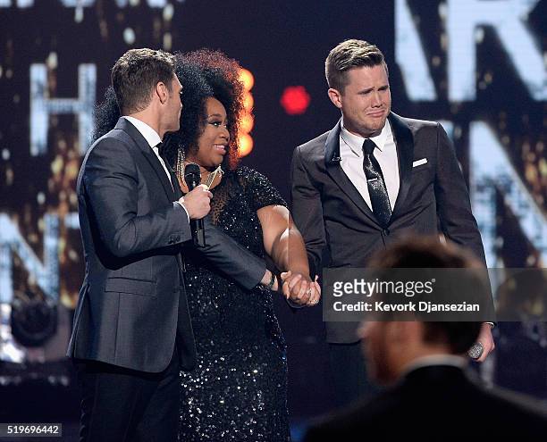 American Idol Season 15 winner Trent Harmon , host Ryan Seacrest and finalist La'Porsha Renae speak onstage during FOX's "American Idol" Finale For...