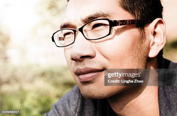 asian man look  outside - linghe zhao stock pictures, royalty-free photos & images