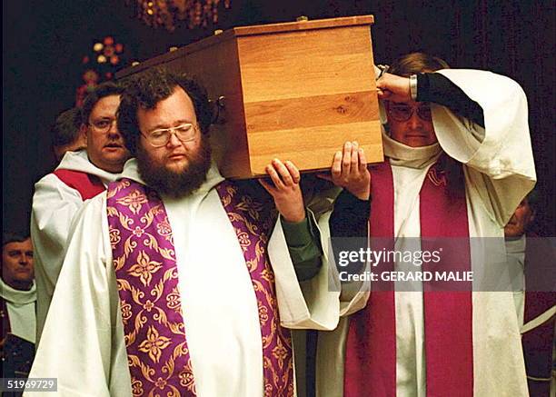 Clerics carry the coffin of 36-year-old White Father Christian Chessel, one of the four fathers executed 27 December by an Armed Islamic Group...