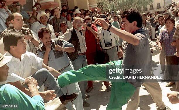 Supporters of Chiapas controversial archbishop Samuel Ruiz clash with anti-rebel protesters 19 February in front of the cathedral of San...