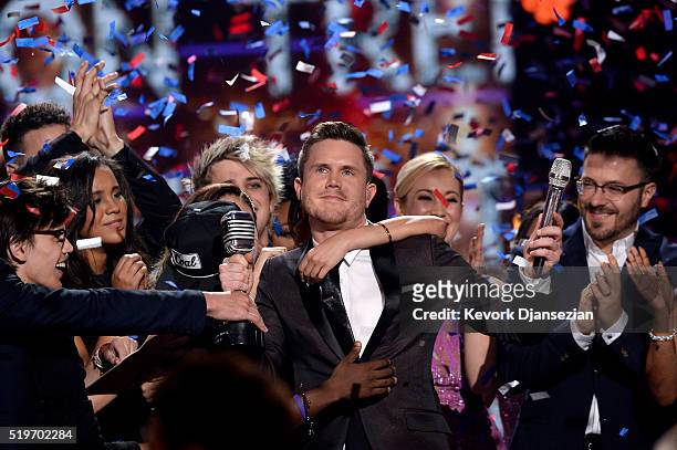 American Idol Season 15 winner Trent Harmon performs coronation song with Season 15 cast onstage during FOX's "American Idol" Finale For The Farewell...
