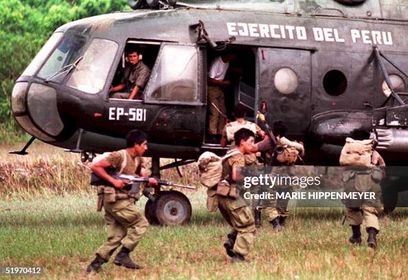 A group of Peruvian soldiers evacuate by helicopte A group of Peruvian soldiers evacuate by helicopte