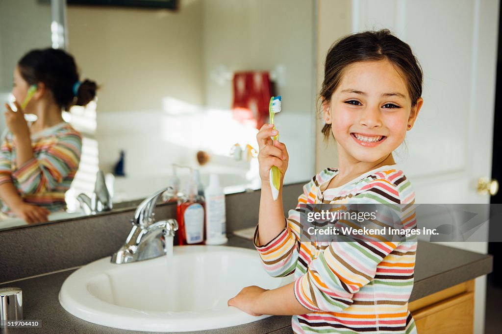 Toddler with toothbrush