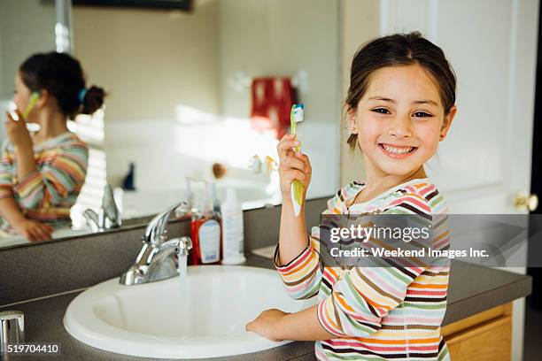 toddler with toothbrush - teeth cleaning stock pictures, royalty-free photos & images