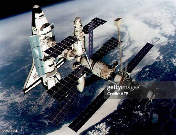 This March 1994 file photo shows a technical rendition of the Space Shuttle Atlantis docked to the Kristall module of the Russian Mir Station. The...