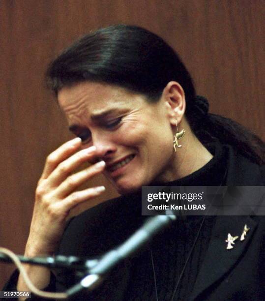 Denise Brown, the sister of murder victim Nicole Brown, cries on the witness stand 06 February in Los Angeles during testimony about her sister's...