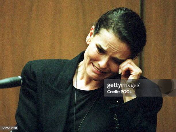 Denise Brown, sister of murder victim Nicole Brown-Simpson, cries as she testifies on the witness stand during the O.J. Simpson murder trial 03...