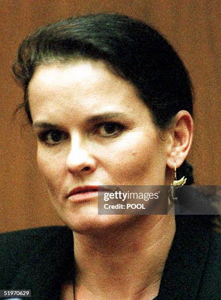 Denise Brown wears an angel earring in memory of her slain sister Nicole Brown- Simpson while testifying 03 February during the O.J. Simpson murder...