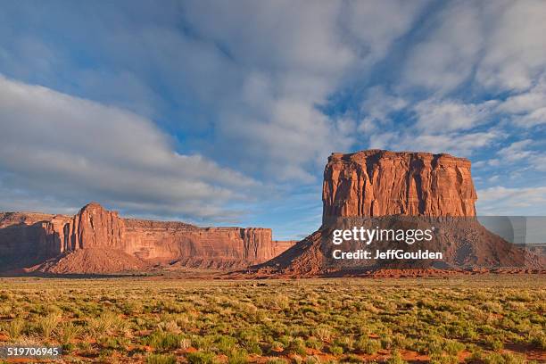 mitchell butte and gray whiskers in the evening light - monument valley tribal park stock pictures, royalty-free photos & images