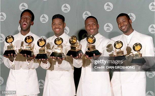 The Boyz II Men singing group pose with their Grammys for Best Rhythm and Blues Album and Best R &amp; B Performance by a Group at the 37th Annual...