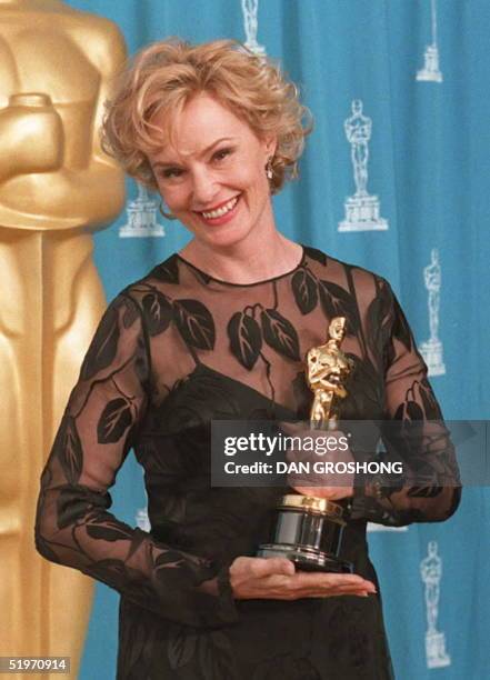 Actress Jessica Lange holds the Oscar she won for her role as Carly Marshall in the film "Blue Sky" 27 March at the Academy Awards in Los Angeles....