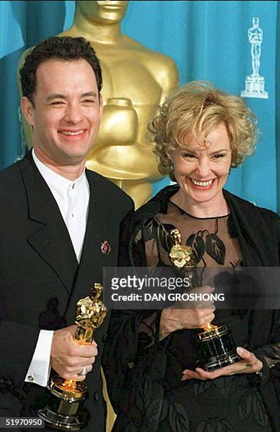 Actors Tom Hanks and Jessica Lange pose with their Oscars at the 67th annual Academy Awards 27 March in Los Angeles. Hanks won as best actor for his...