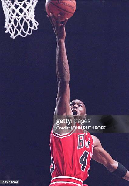 Chicago Bulls basketball star Michael Jordan goes up for a shot in the second half 19 March against the Indiana Pacers at Market Square Arena in...