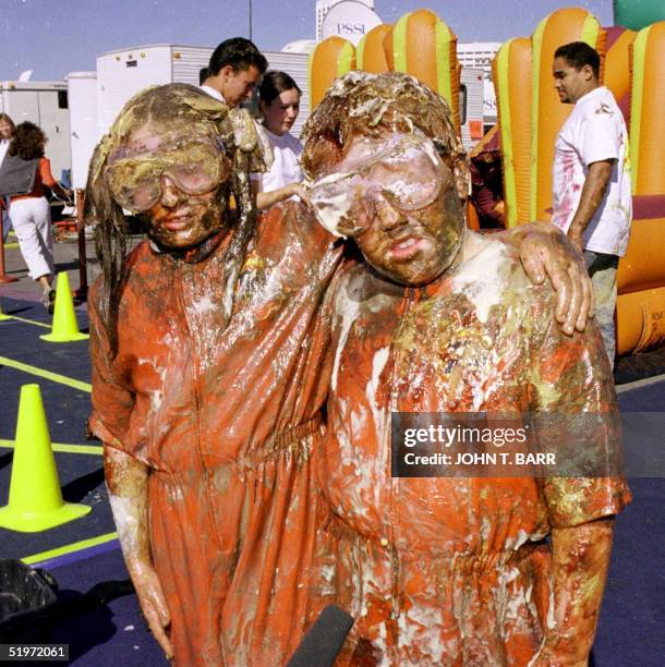 Stephanie Larson and partner Garrett Gilley, both 8 and from El Cajon, CA, pause for a picture after they won first place honors in the "Tide...