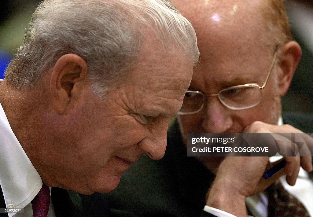 Former US secretary of State James Baker (L), advi