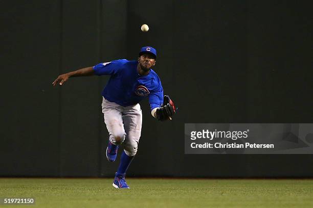 Outfielder Dexter Fowler of the Chicago Cubs makes a running catch during the third inning of the MLB game against the Arizona Diamondbacks at Chase...