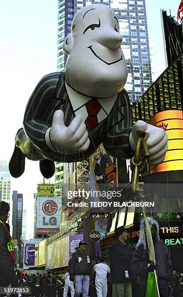 The Ask.com Jeeves balloon moves through Times Square in New York 23 November 2000 during the 74th Macy's Thanksgiving Day Parade. Fourteen marching...