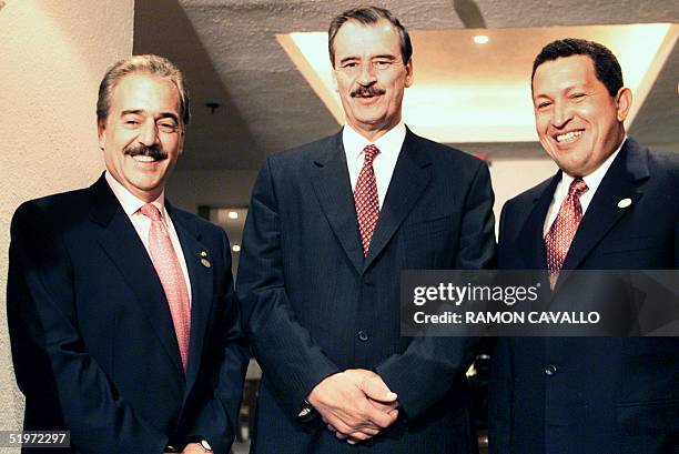 Mexico's president-elect Vicente Fox receives the presidents of Colombia Andres Pastrana and Venezuela Hugo Chavez in Mexico City 30 November 2000...