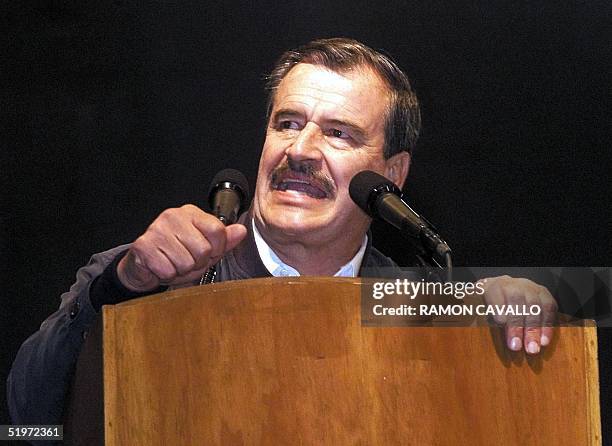 Mexican President Vicente Fox speaks to thousands 02 December 2000 in Monterrey, Mexico. El presidente de Mexico Vicente Fox habla a los miles de...