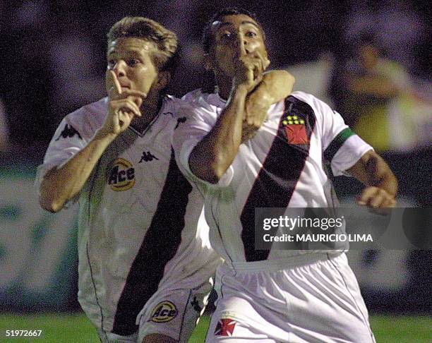 Romario and Juninho celebrate the fourth goal of their team Vasco da Gama against Palmeiras 20 December, 2000 during the Mercosur Cup final at the...