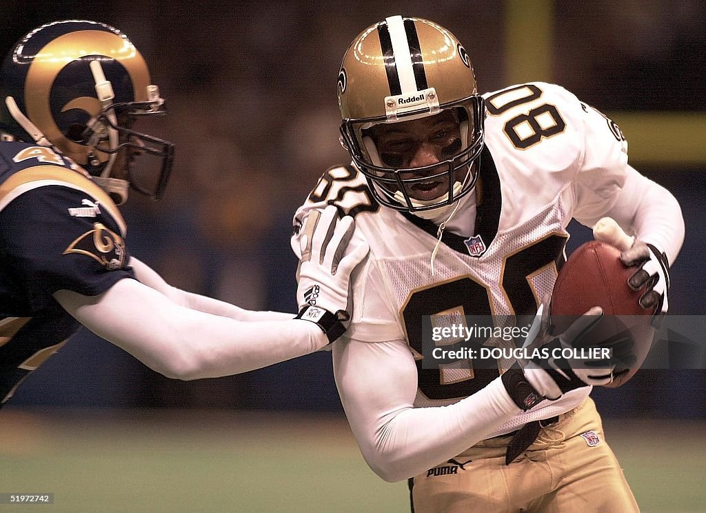 New Orleans Saints' Robert Wilson (R) gets shoved