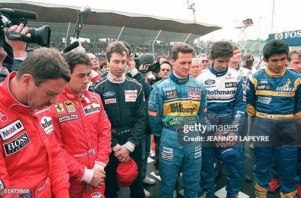 Formula One drivers observe a minute of silence to commemorate the first anniversary of the death of fellow dirvers Ayrton Senna of Brazil and Roland...