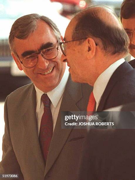 German Finance Minister Theo Waigel greets Allan Greenspan, Chairman of the US Federal Reserve Board, as the two arrive at Blair House for a meeting...