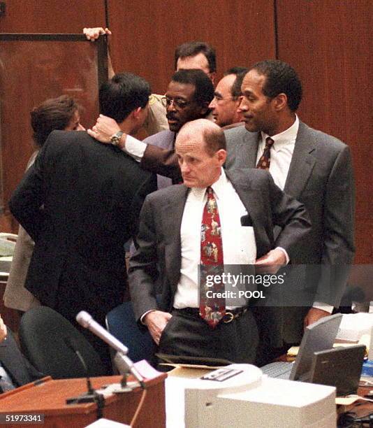 Fung, Johnnie Cochran Jr, Robert Shapiro, O.J. Simpson and Robert Blasier . AFP PHOTO
