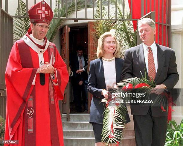 President Bill Clinton and First Lady Hillary Rodham Clinton exit St. Vibiana's Cathedral after attending a Catholic Palm Sunday service with...