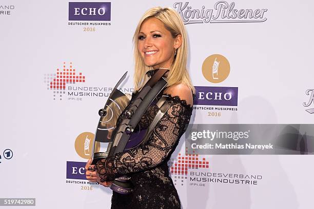 Helene Fischer poses with her awards award at the winners board during the Echo Award 2016 on April 7, 2016 in Berlin, Germany.