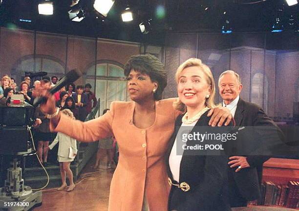 First Lady Hillary Clinton stands with television talk show star Oprah Winfrey during an appearance on Winfrey's television show 16 May. The First...