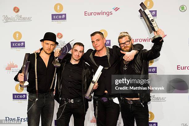 Christian Fohrer, Jonas Notdurfter, Philip Burger and Jochen Gargitter, musicians of the band Freiwild, pose with their awards at the winners board...