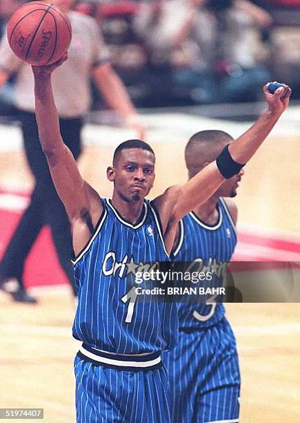 Orlando Magic guard Anfernee Hardaway pumps his fists in the air after the Magic defeated the Chicago Bulls in game three of the Eastern Conference...