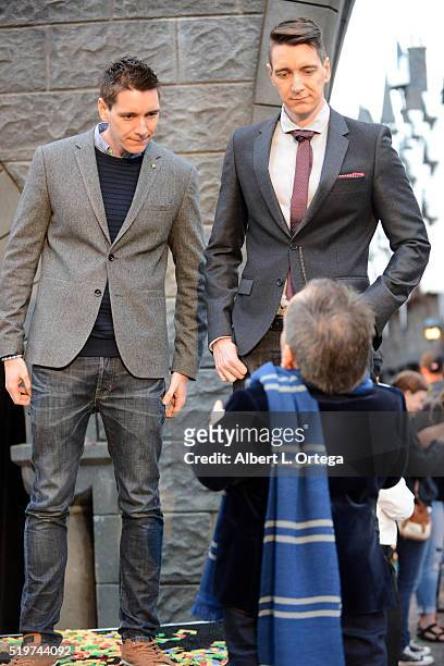 Actors James Phelps, Oliver Phelps and Warwick Davis at the Official Opening Of "The Wizarding World Of Harry Potter" At Universal Studios Hollywood...