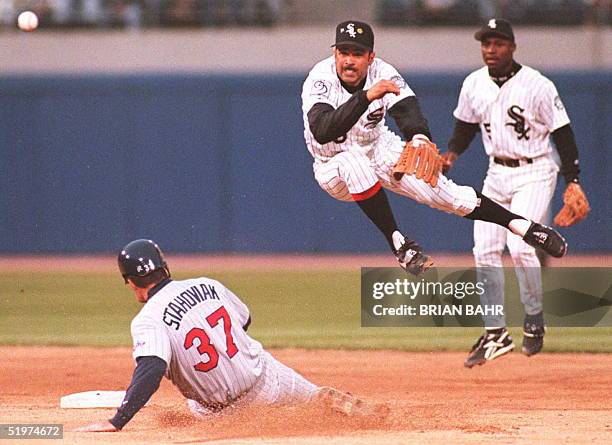 Chicago White Sox shortstop Ozzie Guillen avoids Minnesota Twins runner Scott Stahoviak at second base to complete a double play in the second inning...