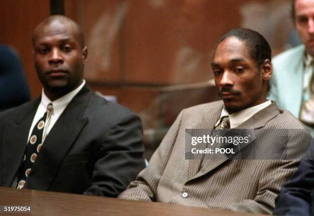 Rapper Snoop Doggy Dogg , whose real name is Clavin Broadus, and his bodyguard McKinley Lee await the reading of a verdict in his murder trial 20...