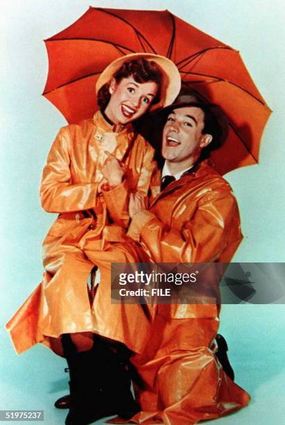 This undated file photo shows US actor Gene Kelly, who died 02 February at the age of 83 at his home in Beverly Hills, California, with actress...