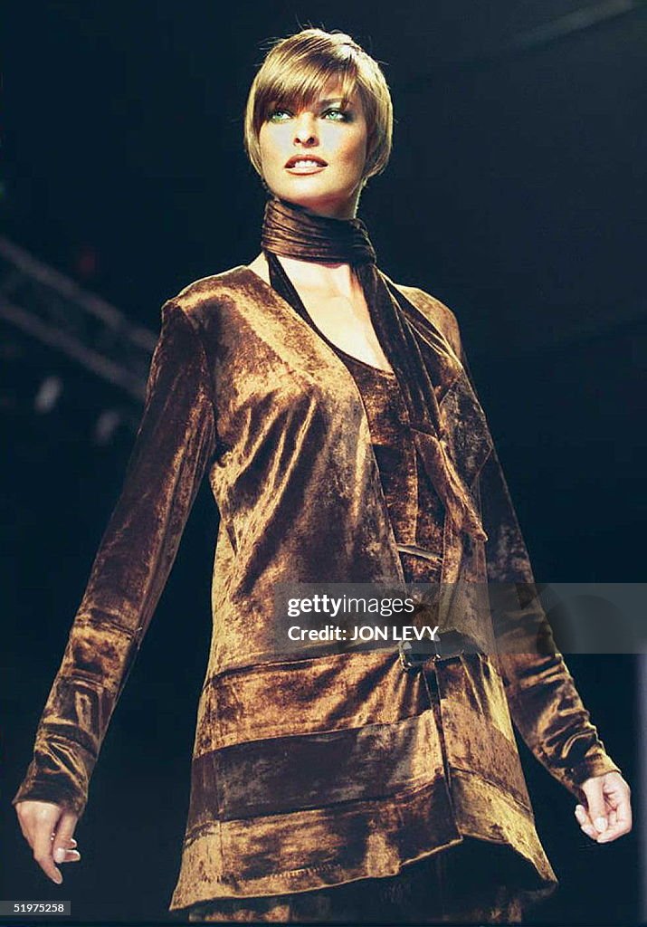 Model Linda Evangelista wears a brown panne jacket